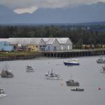 Boats sit near the mouth of the Kenai River on Aug. 22, 2022, in Kenai, Alaska. (Jake Dye/Peninsula Clarion)