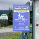 Leashes to lend hang from a kiosk at Mariner Park on Friday, Aug. 12, 2022, in Homer, Alaska. (Photo by Michael Armstrong/Homer News)