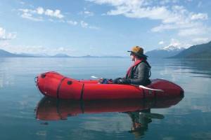 Steven Ireland-Haight sits in his retired packraft early on in his yearlong trip to paddle and walk from Juneau to Washington, D.C., to raise money and awareness about climate change. (Photo courtesy Owen Squires)