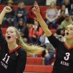 Grace Beiser and Cali Holmes celebrate a score on Aug. 25, 2022, in Kenai, Alaska. (Jake Dye/Peninsula Clarion)