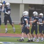 Brayden Taylor and Gehret Medcoff celebrate a touchdown on Friday, Aug. 26, 2022, at Justin Maile Field at Soldotna High School in Soldotna, Alaska. (Jake Dye/Peninsula Clarion)