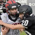 Eielson's Evan Brown is tackled by Nikiski's Wyatt Maguire on Saturday, Aug. 27, 2022, at Nikiski High School in Nikiski, Alaska. (Photo by Jeff Helminiak/Peninsula Clarion)