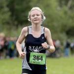 Soldotna freshman Sophia Jedlicki sprints to a first-place finish in the varsity girls race during the Colony Invitational on Saturday, Aug. 27, 2022, at Colony High School in Palmer, Alaska. (Photo by Bruce Eggleston/matsusports.net)