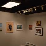 Artwork donated for the Harvest Auction hangs at the Kenai Art Center on Tuesday, Aug. 30, 2022, in Kenai, Alaska. (Jake Dye/Peninsula Clarion)