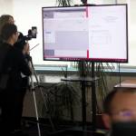 Alaska Division of Elections Director Gail Fenumiai and spokesperson Tiffany Montemayor, left, explain the first-ever tabulation of ranked choice votes as elections programming manager Brian Jackson enters updated results during a livestream Wednesday afternoon. Democrat Mary Peltola prevailed over Republican Sara Palin by willing by nearly 9% on first-choice ballots, then received enough second-choice votes from third candidate Nick Begich III to prevail by an official total of about 3%. (Mark Sabbatini / Juneau Empire)