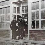 Photo from Once upon the Kenai 
Captain Rose of the S.S. Tyonic, a coal-hauling vessel operating out of the Seldovia area, speaks with Bill Dawson in front of Dawsons Kenai trading post in 1915.