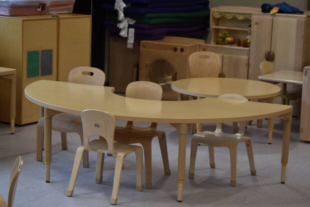 A preschool classroom at the Kahtnuhtana Duhdeldiht Campus is set up with tables and chairs on Thursday, Sept. 1, 2022, in Kenai, Alaska. (Jake Dye/Peninsula Clarion)