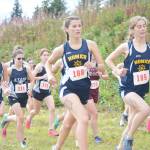 The girls cross-country runners take off at the start of the Homer Invite on Friday, Sept. 2, 2022, at the Lookout Mountain Trails near Homer, Alaska. (Photo by Michael Armstrong/Homer News)
