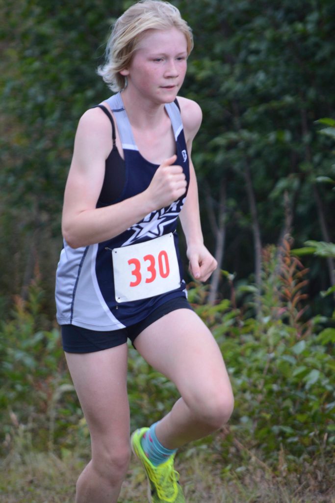 Soldotnas Sophia Jedlicki heads toward the finish line for third place in the Homer Invite on Friday, Sept. 2, 2022, at the Lookout Mountain Trails near Homer, Alaska. (Photo by Michael Armstrong/Homer News)