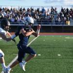 A South Anchorage defender tries to bring down Zac Buckbee during a run at Justin Maile Field in Soldotna, Alaska on Friday, Sept. 2, 2022. The run would be called back due to offsetting penalties. (Jake Dye/Peninsula Clarion)