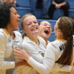 The Nikiski volleyball team celebrates after defeating Soldotna on Thursday, Sept. 8, 2022, at Soldotna High School in Soldotna, Alaska. (Photo by Jake Dye/Peninsula Clarion)