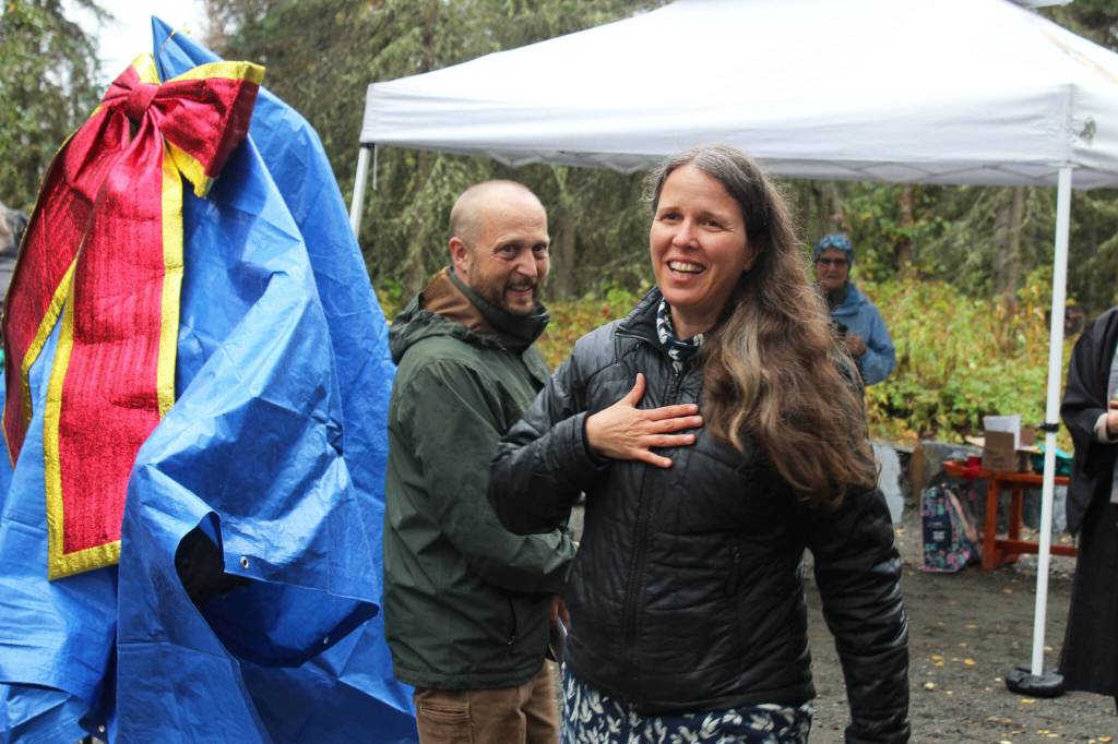 Artist Christina Demetro prepares to unveil a sculpture as part of the grand opening of the Kenai Peninsula Peace Crane Garden Trails on Thursday, Sept. 8, 2022, in Soldotna, Alaska. (Ashlyn OHara/Peninsula Clarion)