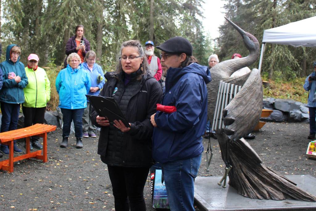 Jon Ross and Wanda Ream read a Denaina prayer at the grand opening and dedication of the Kenai Peninsula Peace Crane Garden Trails on Thursday, Sept. 8, 2022, in Soldotna, Alaska. (Ashlyn OHara/Peninsula Clarion)