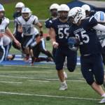 Gehret Medcoff runs with the ball at Justin Maile Field in Soldotna, Alaska on Friday, Sept. 9, 2022. (Jake Dye/Peninsula Clarion)