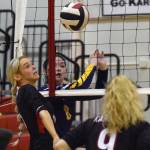 Kenai Centrals Cali Holmes keeps the ball alive in front of Homers Brooke Shafer on Friday, Sept. 9, 2022, at Kenai Central High School in Kenai, Alaska. (Photo by Jeff Helminiak/Peninsula Clarion)
