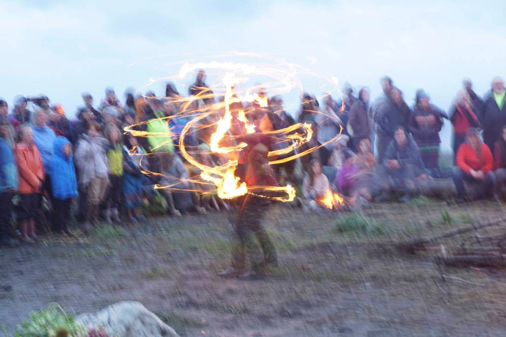 A fire dancer spins flames at the 19th annual Burning Basket, Breathe, on Sunday, Sept. 11, 2022, at Mariner Park on the Homer Spit in Homer, Alaska. (Photo by Michael Armstrong/Homer News)