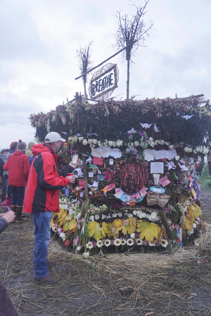 People interact with the 19th annual Burning Basket, Breathe, on Sunday, Sept. 11, 2022, at Mariner Park on the Homer Spit in Homer, Alaska. (Photo by Michael Armstrong/Homer News)