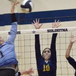 Soldotna's Katelyn Morrison attacks on Homer's Alivia Fefelov and Goldie Hill on Tuesday, Sept. 13, 2022, at Soldotna High School in Soldotna, Alaska. (Photo by Jeff Helminiak/Peninsula Clarion)