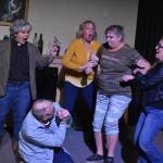 From left: Lacey Jane Brewster, Terri Zopf-Schoessler, Donna Shirnberg, Tracie Sanborn and Bill Taylor (center) rehearse Menopause Made Me Do It on Tuesday, Sept. 13, 2022, in Soldotna, Alaska. (Jake Dye/Peninsula Clarion)