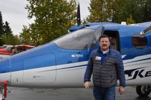 Joel Caldwell shows off the new Tecnam Traveller on Thursday, Sept. 15, 2022, in Kenai, Alaska. (Jake Dye/Peninsula Clarion)