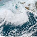This image provided by the National Hurricane Center and Central Pacific Hurricane Center/National Oceanic and Atmospheric Administration shows a satellite view over Alaska, Thursday, Sept. 15, 2022. A vast swath of western Alaska could see flooding and high winds as the remnants of Typhoon Merbok move toward the Bering Sea region. The National Weather Service had in place coastal flood warnings, beginning Friday, spanning from parts of the Yukon Delta in southwest Alaska up to St. Lawrence Island in the Bering Sea and to the Bering Strait coast. (NOAA via AP)