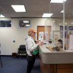 Mark Sabbatini / Juneau Empire
Kelsey Martin asks about the status of her sons Permanent Fund Dividend check after arriving first at Juneaus PFD office in the State Office Building on Tuesday, the first day direct deposit payments of the $3,284 dividends are being credited. Eligible residents who did not receive direct deposits will be paid by checks that will be mailed starting Oct. 6.