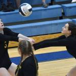 Sewards Robin Cronin and Olive Sayler combine to dig up a ball against Soldotna on Tuesday, Sept. 20, 2022, at Soldotna High School in Soldotna, Alaska. (Photo by Jeff Helminiak/Peninsula Clarion)