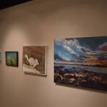 Artwork donated for the Harvest Auction hangs at the Kenai Art Center on Tuesday, Aug. 30, 2022, in Kenai, Alaska. (Jake Dye/Peninsula Clarion)