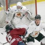Kenai River Brown Bears goalie Bryant Marks saves a shot by Jack Ring of the Fairbanks Ice Dogs on Friday, March 12, 2022, at the Soldotna Regional Sports Complex in Soldotna, Alaska. (Photo by Jeff Helminiak/Peninsula Clarion)