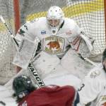 Kenai River Brown Bears goalie Bryant Marks saves a shot by Jack Ring of the Fairbanks Ice Dogs on Friday, March 12, 2022, at the Soldotna Regional Sports Complex in Soldotna, Alaska. (Photo by Jeff Helminiak/Peninsula Clarion)