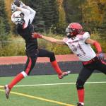 Kenai Central receiver Wade James catches a touchdown over Houstons Hunter Craig on Saturday, Sept. 24, 2022, at Ed Hollier Field at Kenai Central High School in Kenai, Alaska. (Photo by Jeff Helminiak/Peninsula Clarion)