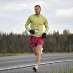Lars Arneson runs to a victory and new event record in the Kenai River Marathon on Sunday, Sept. 25, 2022, in Kenai, Alaska. (Photo by Jeff Helminiak/Peninsula Clarion)