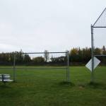 Fencing surrounds the upper fields at Nikiski Middle/High School on Monday, Sept. 19, 2022. The field is the proposed relocation site of the schools track and field, which is part of a bond package Kenai Peninsula Borough voters will consider next month. (Ashlyn OHara/Peninsula Clarion)