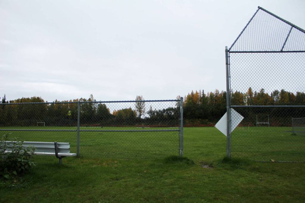 Fencing surrounds the upper fields at Nikiski Middle/High School on Monday, Sept. 19, 2022. The field is the proposed relocation site of the schools track and field, which is part of a bond package Kenai Peninsula Borough voters will consider next month. (Ashlyn OHara/Peninsula Clarion)