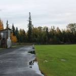 Water pools on a warped track at Nikiski Middle/High School on Monday, Sept. 19, 2022, in Nikiski, Alaska. The track is one of several projects in a bond package Kenai Peninsula voters will consider during the Oct. 4 municipal election next month. (Ashlyn OHara/Peninsula Clarion)
