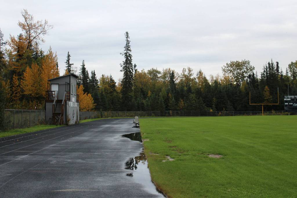 Water pools on a warped track at Nikiski Middle/High School on Monday, Sept. 19, 2022, in Nikiski, Alaska. The track is one of several projects in a bond package Kenai Peninsula voters will consider during the Oct. 4 municipal election next month. (Ashlyn OHara/Peninsula Clarion)