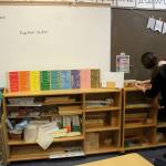 Teacher April Dixon adjusts Montessori materials in a classroom at Soldotna Montessori Charter School on Tuesday, Sept. 20, 2022, in Soldotna, Alaska. (Ashlyn OHara/Peninsula Clarion)