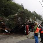 Clarise Larson / Juneau Empire
People gathered Tuesday morning at the section of Gastineau Avenue that sustained damage from a landslide on Monday, Sept. 26, in Juneau, Alaska. The day after the landslide, officials assessed damage and prepared for a multi-day cleanup effort.