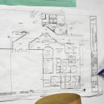 Kenai Middle School Principal Vaughn Dosko points out elements of a redesign plan for the front of the school on Wednesday, Sept. 21, 2022, in Kenai, Alaska. (Ashlyn OHara/Peninsula Clarion)