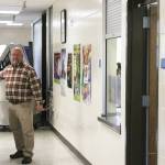 Kenai Middle School Principal Vaughn Dosko gestures toward a cart used to provide school lunch services on Wednesday, Sept. 21, 2022, in Kenai, Alaska. (Ashlyn OHara/Peninsula Clarion)