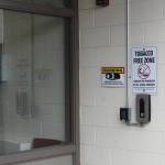 A camera and doorbell are mounted outside of the entrance to Kenai Middle School on Wednesday, Sept. 21, 2022, in Kenai, Alaska. (Ashlyn OHara/Peninsula Clarion)