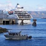 Photo by Michael Armstrong/Homer News
A fishing boat passes the Silversea cruise ship Silver Wind as the boat enters the Homer Harbor on Sunday, Sept. 25, in Homer.