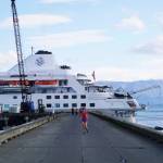 A jogger leaves the Silversea cruise ship Silver Wind at the Deep Water Dock on Sunday, Sept. 25, 2022, in Homer, Alaska. (Photo by Michael Armstrong/Homer News)