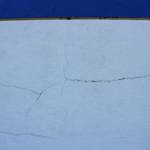 Cracks split the siding outside of Soldotna High School on Tuesday, Sept. 27, 2022, in Soldotna, Alaska. The siding is one of several projects in a bond package Kenai Peninsula voters will consider during the Oct. 4 municipal election. (Ashlyn OHara/Peninsula Clarion)