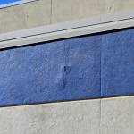 Cracks split the siding outside of Soldotna High School on Tuesday, Sept. 27, 2022, in Soldotna, Alaska. The siding is one of several projects in a bond package Kenai Peninsula voters will consider during the Oct. 4 municipal election. (Ashlyn OHara/Peninsula Clarion)