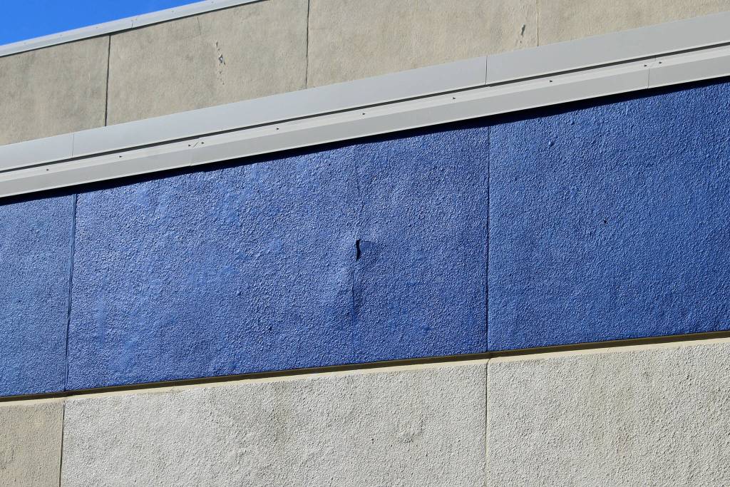 Cracks split the siding outside of Soldotna High School on Tuesday, Sept. 27, 2022, in Soldotna, Alaska. The siding is one of several projects in a bond package Kenai Peninsula voters will consider during the Oct. 4 municipal election. (Ashlyn OHara/Peninsula Clarion)
