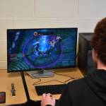 Kenai League of Legends team captain Silas Thibodeau watches the defeat animation as his nexus is destroyed during the first game on Tuesday, Sept. 27, 2022, at Kenai Central High School in Kenai, Alaska. (Jake Dye/Peninsula Clarion)