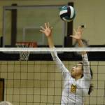 Nikiski's Alexa Iyatunguk leaps to block a ball on Thursday, Sept. 29, 2022 at Nikiski Middle/High School in Nikiski, Alaska. (Jake Dye/Peninsula Clarion)