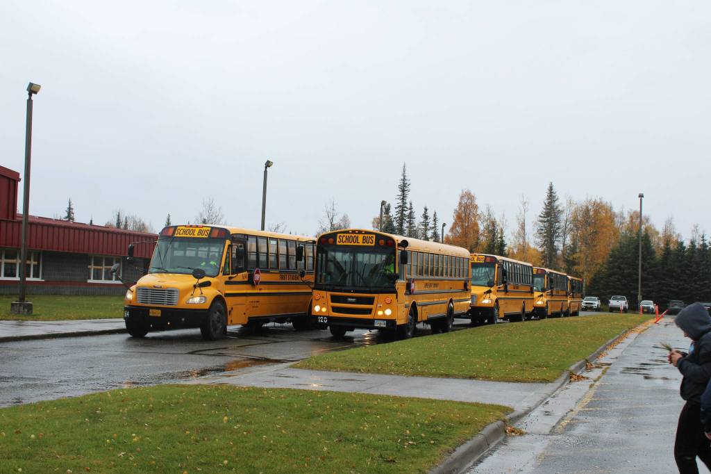 Buses line up ahead of dismissal at Mountain View Elementary School on Thursday, September 29, 2022, in Kenai, Alaska. A bond package up for consideration by Kenai Peninsula Borough voters on Oct. 4 would fund improvements to the schools traffic flow. (Ashlyn OHara/Peninsula Clarion)
