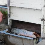 Soldotna Elementary School Principal Dr. Austin Stevenson points out corroded insulation outside of the school building on Friday, Sept. 30, 2022, in Soldotna, Alaska. (Ashlyn OHara/Peninsula Clarion)